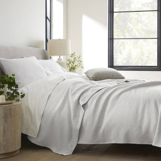 Whisper Organics Organic Cotton Woven Blanket – on a bed