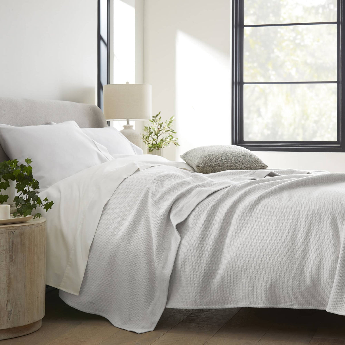 Whisper Organics Organic Cotton Woven Blanket – on a bed