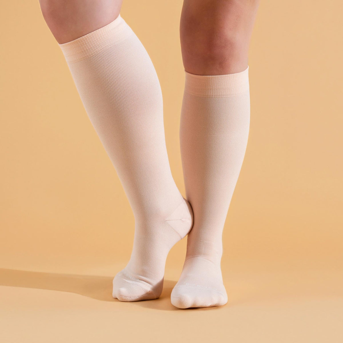 Comrad Knee-High Compression Socks, Solid 20-30 mmHg, Rose – shown worn