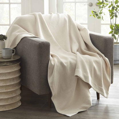Whisper Organics Organic Cotton Woven Blanket – on a chair