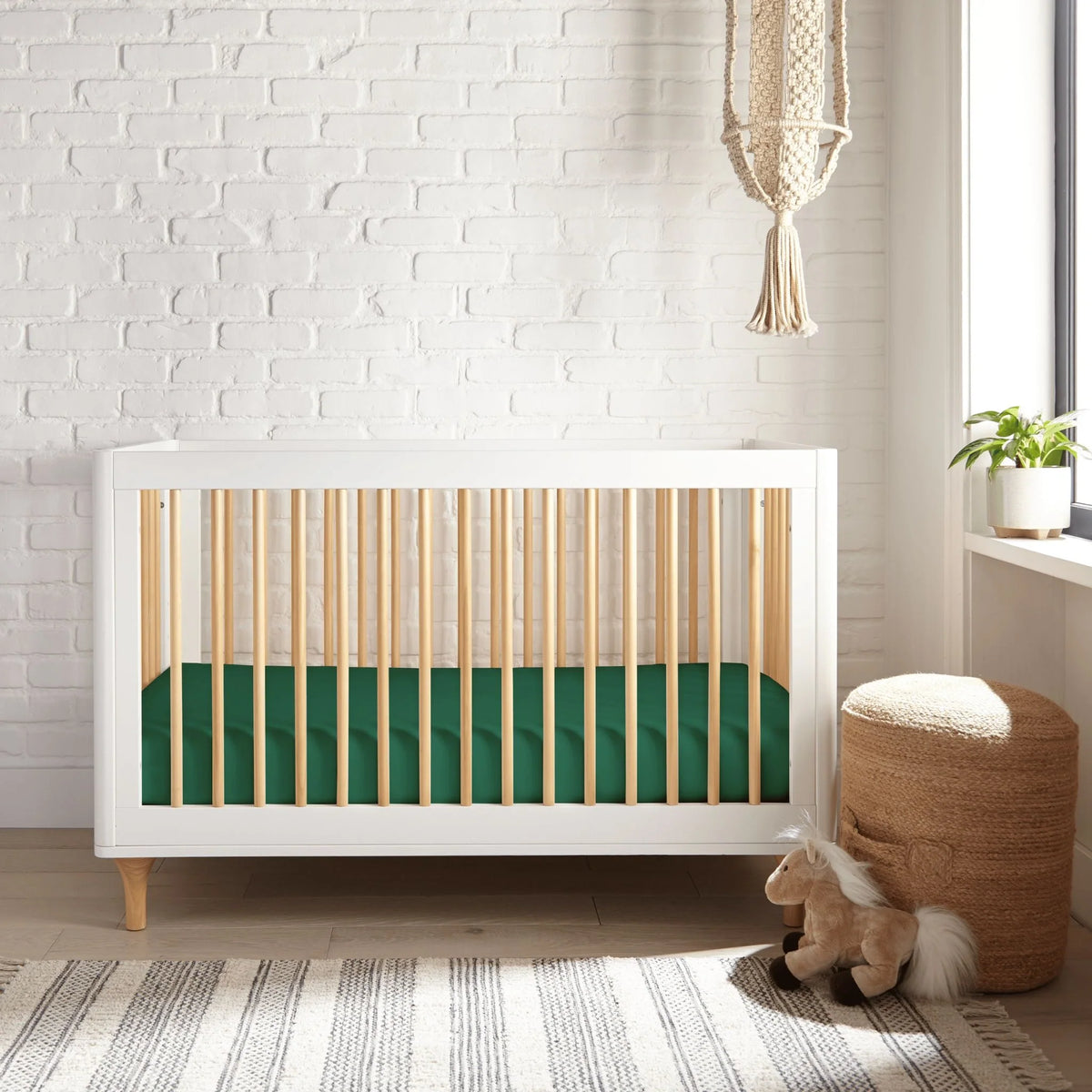 Bamboo is Better Cooling Bamboo Crib Fitted Sheet, Emerald Green – on a bed